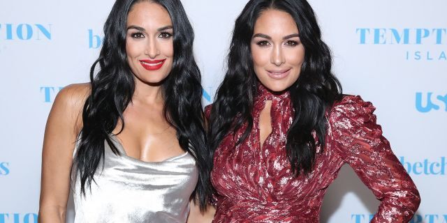 Nikki Bella, left, and twin sister Brie Bella at the Highlight Room at Dream Hotel in Hollywood, Calif. on October 2, 2019.