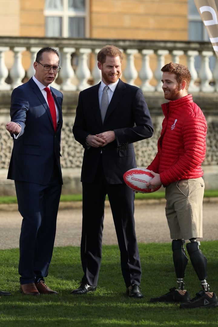 Prince Harry with Jon Dutton (left), chief executive of the Rugby League World Cup 2021, and Leeds Rhino player James Simpson