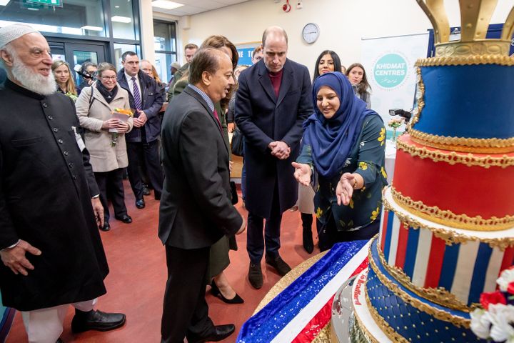 The Duke and Duchess of Cambridge inspect cakes as they visit the Khidmat Centre.