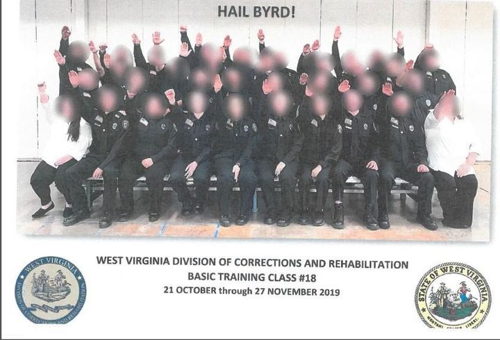 Government employees working for West Virginia's Division of Corrections and Rehabilitation make a Nazi salute in a class pho