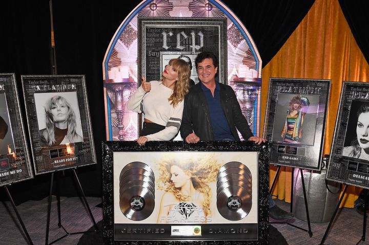Taylor Swift and Big Machine Records CEO Scott Borchetta at a plaque presentation backstage at MetLife Stadium on July 21, 20