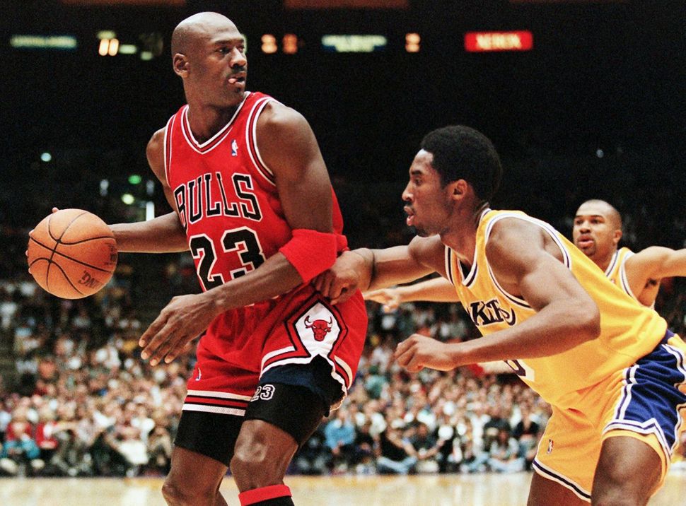 Jordan eyes the basket as he is guarded by Kobe Bryant of the Los Angeles Lakers in a Feb. 1, 1998, game.