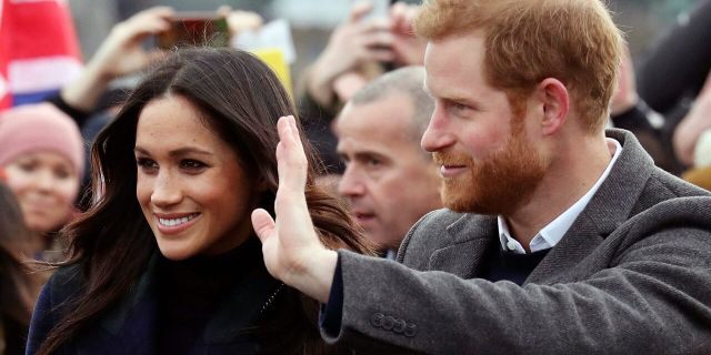 Britain's Prince Harry and Meghan Markle during a walkabout with Britain's Prince Harry on the esplanade at Edinburgh Castle, Scotland, Tuesday, Feb. 13, 2018. 