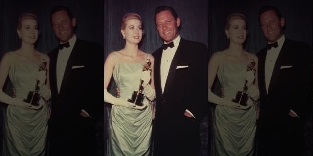 Grace Kelly and William Holden attend the 27th Academy Awards ceremony. 