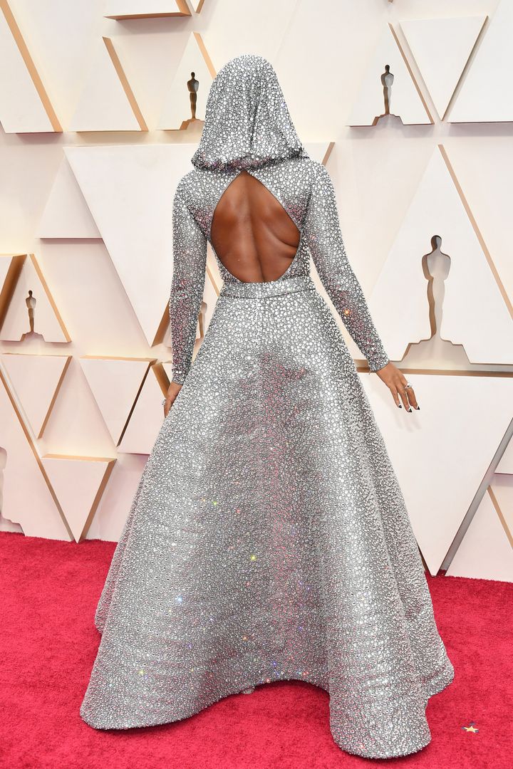 Mon&aacute;e showed the detail of her custom Ralph Lauren gown on the Oscars red carpet on Sunday in Los Angeles.
