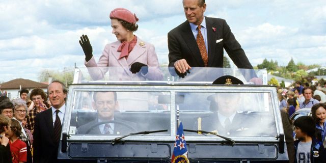 Queen Elizabeth and Prince Philip wave to the crowd during their 1981 tour of New Zealand. It was on this tour where Queen Elizabeth narrowly avoided an attempt on her life.