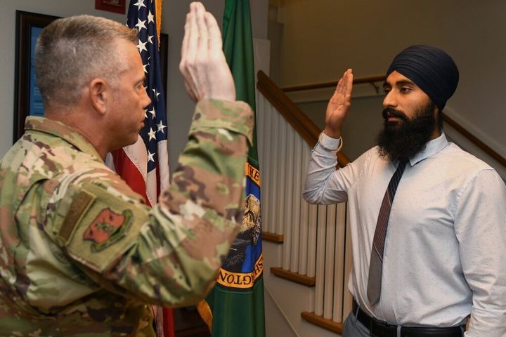 Gurchetan Singh recites the oath of enlistment on Sept. 27, 2019, at Camp Murray in Washington state. Singh is the first Sikh