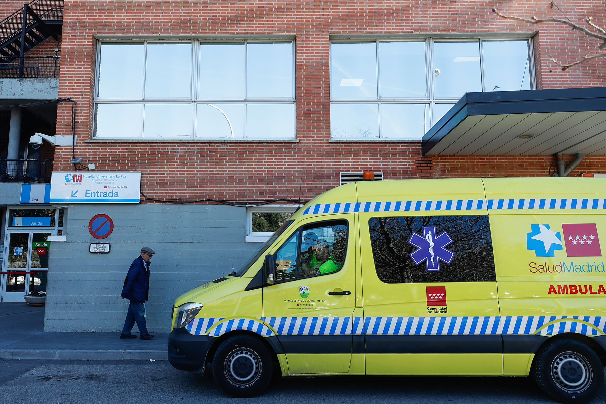 An ambulance is parked outside Carlos III hospital in Madrid, Spain, Wednesday, February 26. 