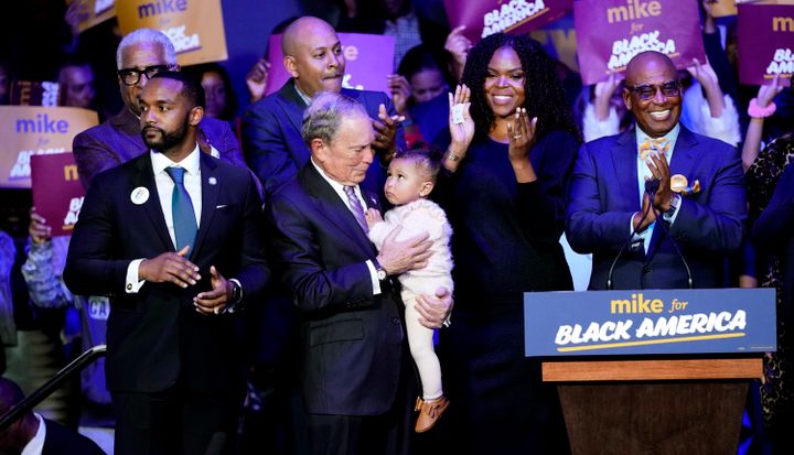 Michael Bloomberg is joined on stage by supporters for his campaign's launch of "Mike for Black America" on Feb. 13, 2020, in