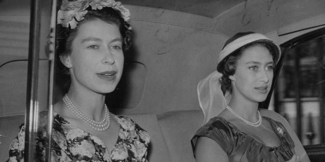 Queen Elizabeth II, left, and Princess Margaret. (Photo by PA Images via Getty Images)