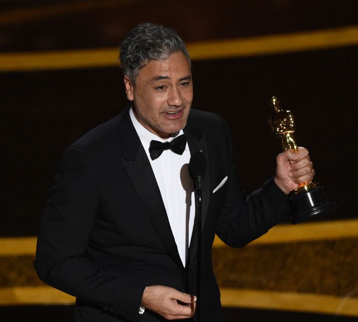 Taika Waititi accepts the award for Best Adapted Screenplay for "Jojo Rabbit" at the Oscars.