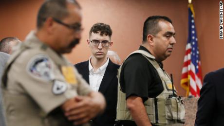 Patrick Crusius, center, appeared in court during an arraignment last October in El Paso.