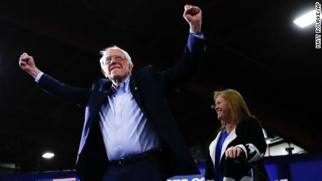 Sanders accompanied by his wife Jane O&#39;Meara Sanders, arrives to speak during a primary night election rally in Essex Junction, Vt., Tuesday, March 3, 2020.