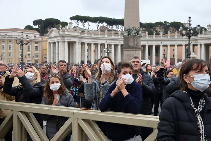 Pilgrims arrive in St. Peter's Square at the Vatican wearing masks to protect themselves from COVID-19 on March 1.