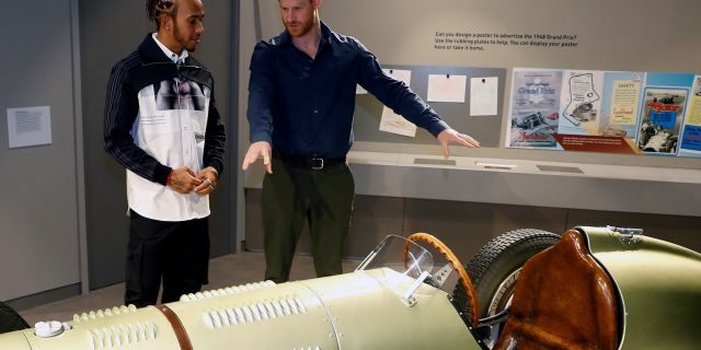 Prince Harry, Duke of Sussex speaks with Formula One World Champion Lewis Hamilton as he officially opens The Silverstone Experience at Silverstone on March 6.