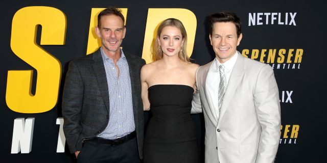 Peter Berg, left, Iliza Shlesinger, center, and Mark Wahlberg attend the Netflix Premiere Spenser Confidential at Westwood Village Theatre on February 27, 2020, in Westwood, Calif. (Photo by Joe Scarnici/Getty Images for Netflix)