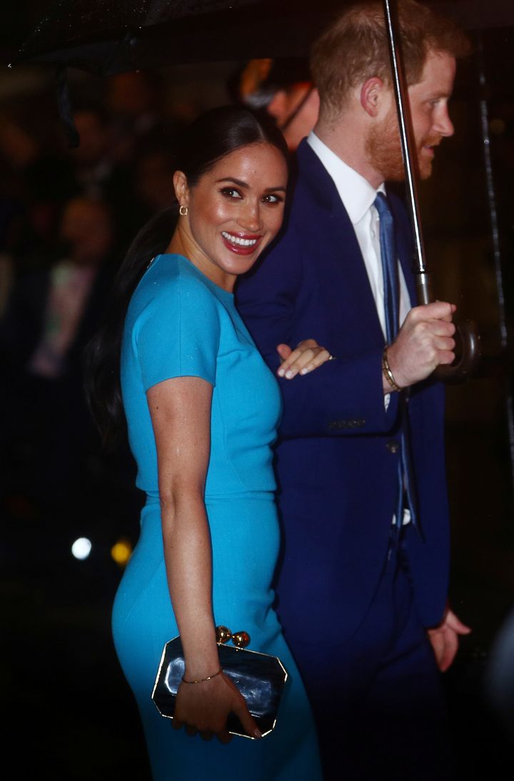 Meghan wears a turquoise dress and a bold red lip to the Endeavour Fund Awards in London on March 5.