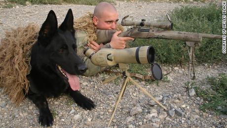 Wesley Black in Paktia Provence, Afghanistan in 2010 with military working dog &quot;Blek.&quot;