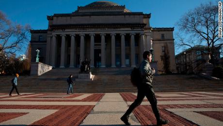 A man walks past Low Library on the Columbia University campus, Monday, March 9, 2020, in New York.