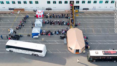 Canadians disembark from the Grand Princess cruise ship at the Port of Oakland in California.