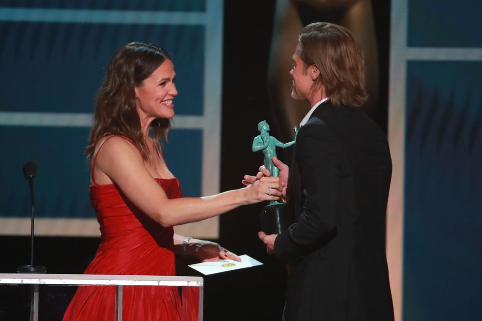 Brad Pitt accepts his award from Jennifer Garner onstage during the 26th Annual Screen Actors&nbsp;Guild Awards on Jan. 19, 2