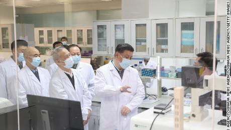 Chinese President Xi Jinping inspects scientific research on the coronavirus during his visit to the Academy of Military Medical Sciences in Beijing on March 2.