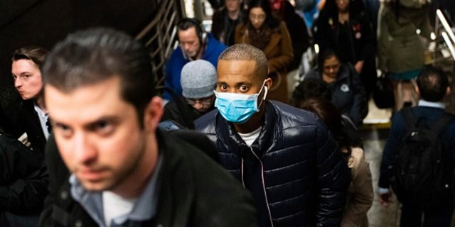 NEW YORK, NY - MARCH 09: A man wearing a protective mask is seen on a subway platform on March 9, 2020 in New York City. There are now 20 confirmed coronavirus cases in the city including a 7-year-old girl in the Bronx. (Photo by Jeenah Moon/Getty Images)