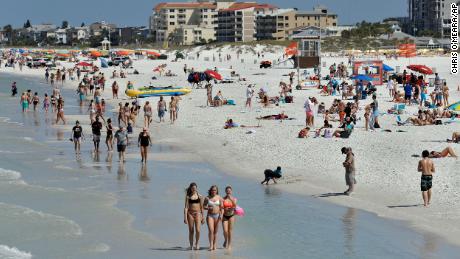 &#39;Get off the beach&#39;: Florida&#39;s governor under pressure as images of crowded beaches go viral