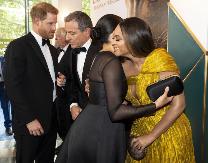 Harry chats with Disney CEO Robert Iger as Meghan embraces Beyonc&eacute; as they attend the European premiere of the "The Li