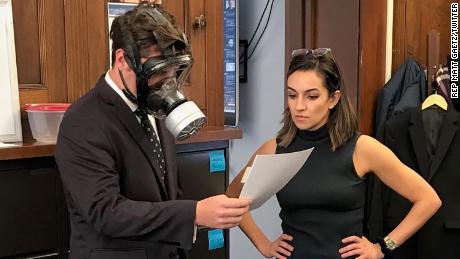 An image of Gaetz wearing the gas mask ahead of the vote.