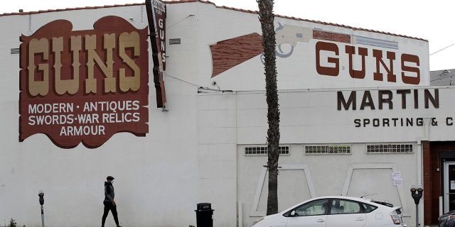 Guns are advertised for sale at a gun shop Tuesday, March 24, 2020, in Culver City, Calif. (AP Photo/Marcio Jose Sanchez)