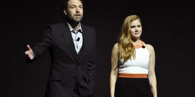 Ben Affleck and Amy Adams, cast members in the film 'Batman v Superman: Dawn of Justice,' address the audience during the Warner Bros. presentation at CinemaCon 2016.