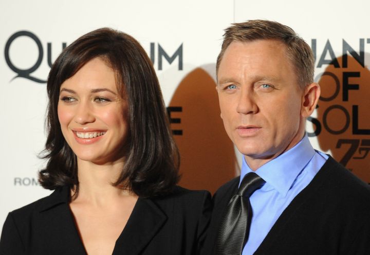Olga Kurylenko and Daniel Craig pose at a 2008 screening of "Quantum of Solace" in Rome.