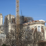 Workers dismantle the scaffolding on the