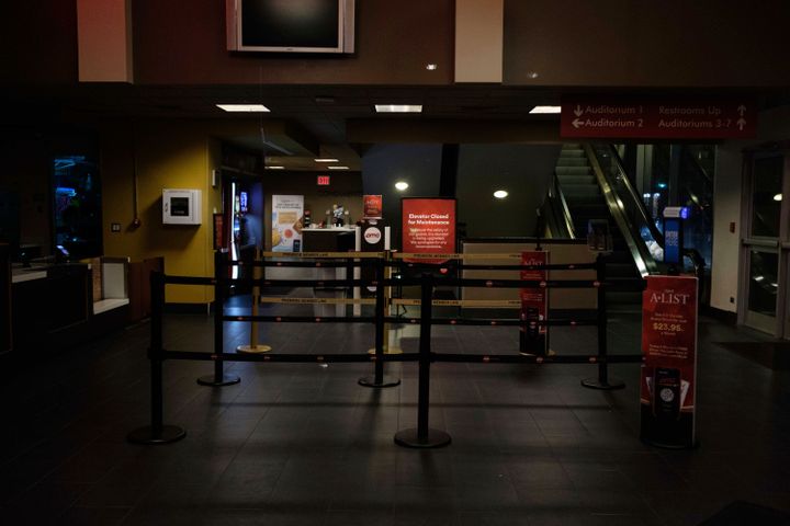 An empty AMC movie theater lobby in New York on Monday night.