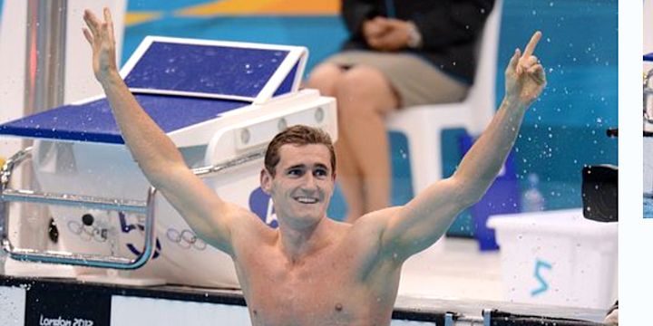 Cameron van der Burgh raises his arms in victory at the 2012 Olympics.