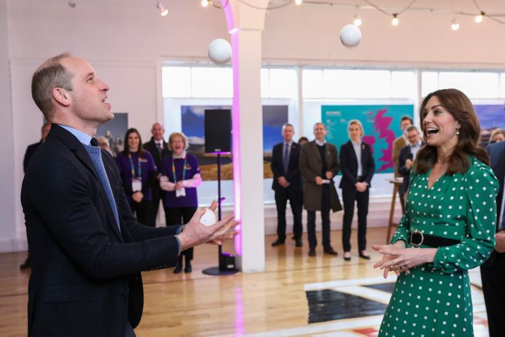 The Duke of Cambridge juggles during a meeting with Galway Community Circus performers, local artists and young musicians on 