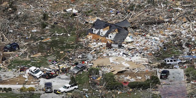 The remains of homes shattered by storms are scattered near Cookeville, Tenn.