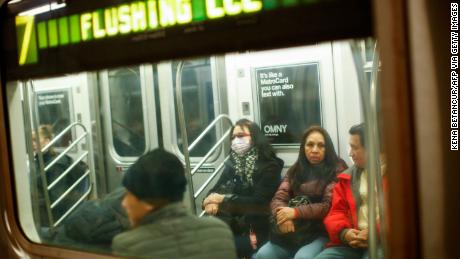 NYC keeps schools and subways open but cancels large events
