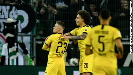 Dortmund&#39;s Thorgan Hazard celebrates his goal with his teammate and fellow Belgian midfielder Axel Witsel.