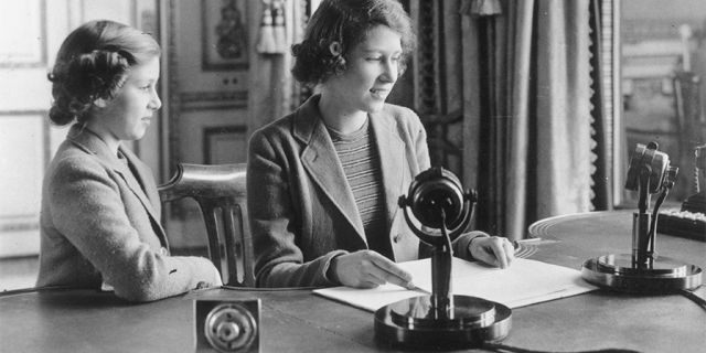 Princess Elizabeth makes her first broadcast, accompanied by her younger sister Princess Margaret Rose October 12, 1940, in London.