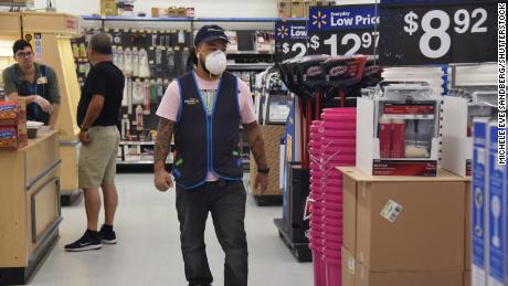 Walmart will start taking employees&#39; temperatures and let them wear masks