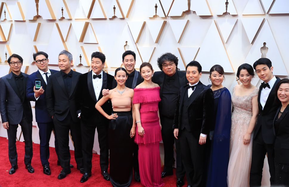 Director Bong Joon-ho (sixth from the right) and cast and crew members of the film "Parasite" at this year's Academy Awards i