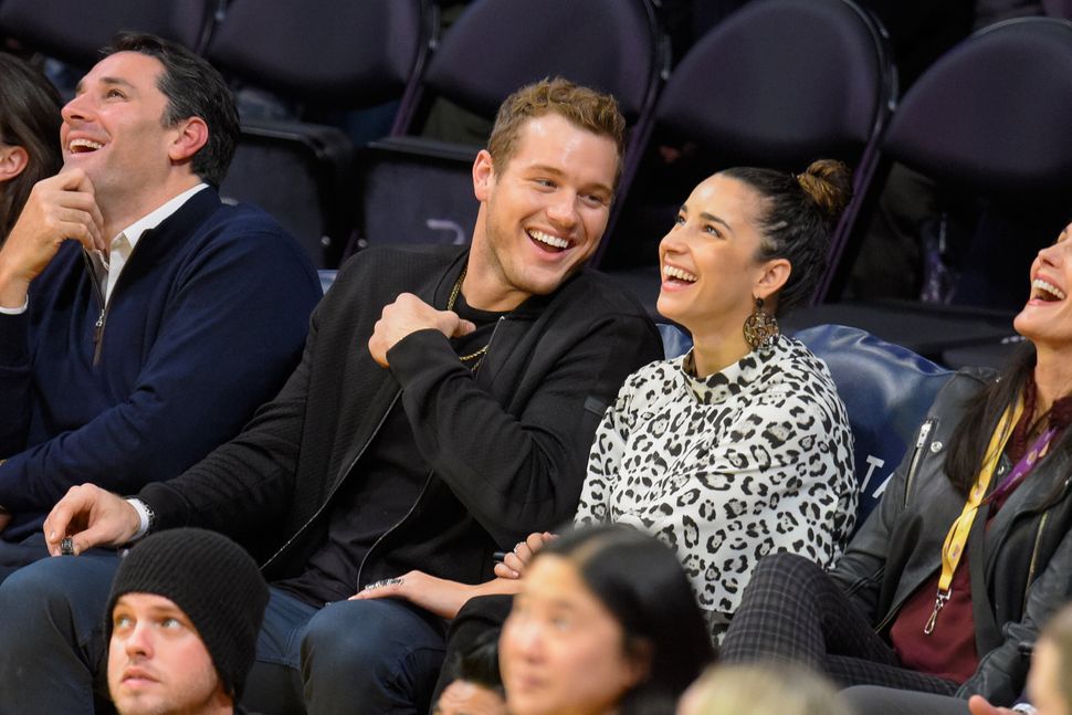 Colton Underwood (L) and Aly Raisman attend a basketball game between the Portland Trail Blazers and the Los Angeles Lakers a
