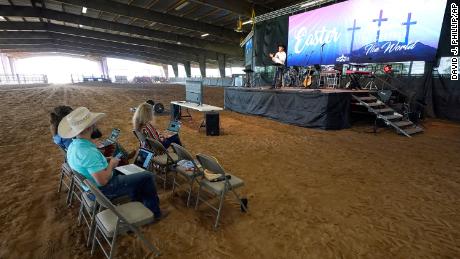 Lone Star Cowboy Church Pastor Randy Weaver, right, conducts a livestreamed service in Montgomery, Texas.