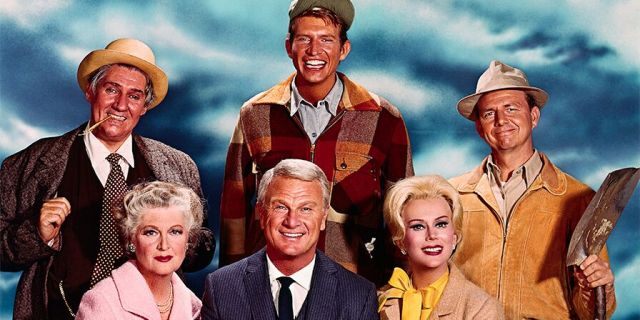 Publicity photo of the cast of 'Green Acres' left to right: Pat Buttram as Mr. Haney, and Tom Lester as Eb Dawson, Alvy Moore as Hank Kimball (seated), Mother on series (unidentified), Eddie Albert as Oliver Douglas and Eva Gabor as Lisa Douglas.