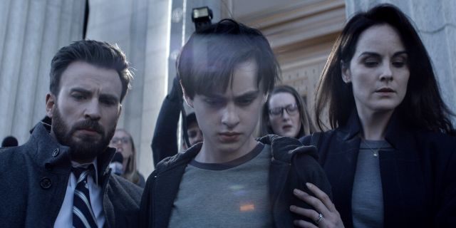 Chris Evans (L), Jaeden Martell (C), and Michelle Dockery (R) in a scene from 'Defending Jacob.'