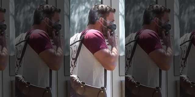 Actor Ben Affleck smokes a cigarette on the street in Los Angeles while out and about running errands.