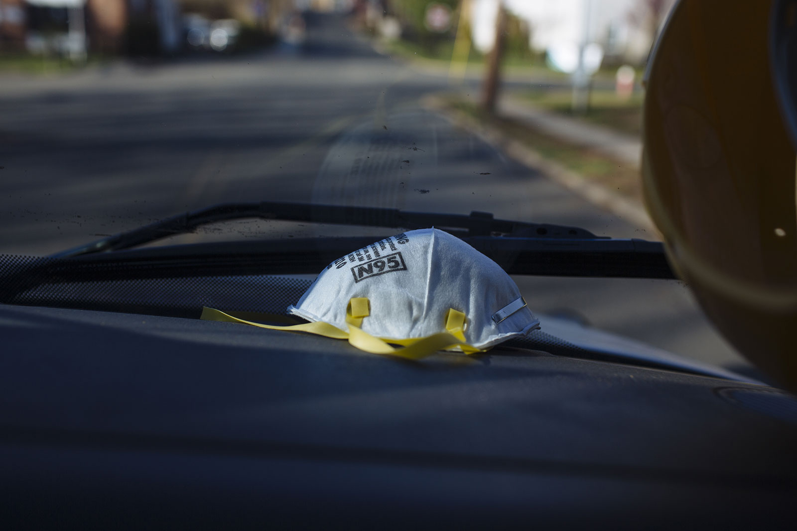 An N95 protective mask sits on the dashboard of an ambulance in Teaneck, New Jersey, on Saturday, April 11.