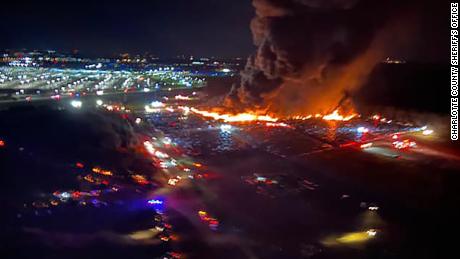 The fire sent plumes of smoke into the air near the airport.